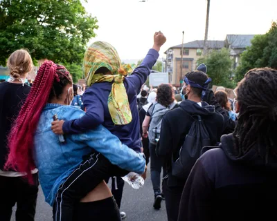 A child raises a fist during a Black Lives Matter march in Portland, Oregon, May 31, 2020.