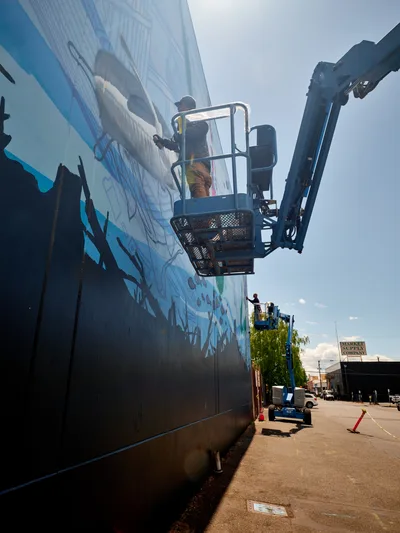 Mural Artists Create Street Art on Lift