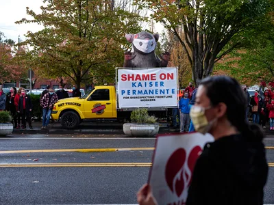 Inflatable Rat Towers Over Kaiser Strike