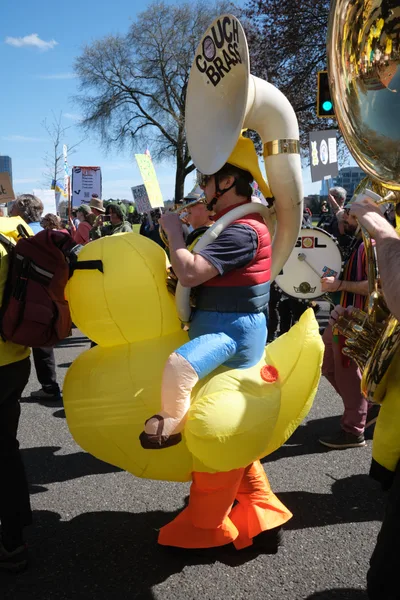Protest Musician in Rubber Duck Costume