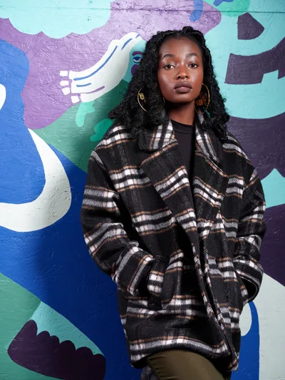 Artist Naomi Likayi Against Portland Mural