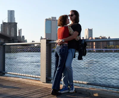 Golden Hour Embrace by Brooklyn Bridge