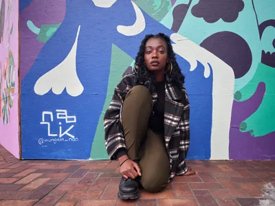 Artist Naomi Likayi with Downtown Portland Mural