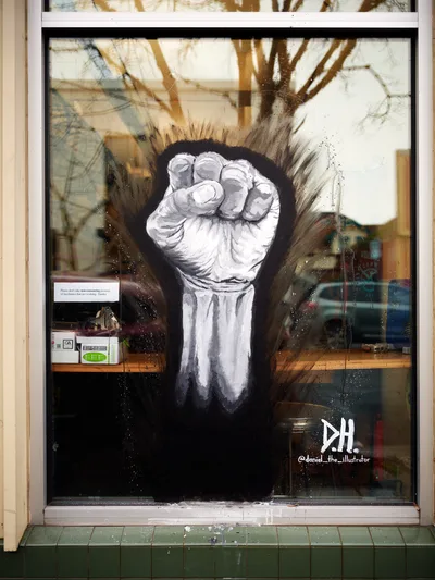 Raised Fist Mural on Alberta Street Storefront