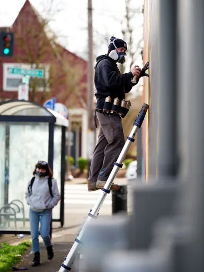 Street Artist Painting Mural in Portland